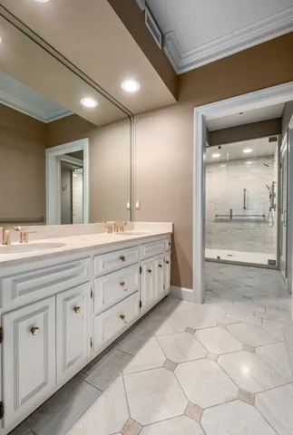 a spacious bathroom with a double vanity sink mirror and