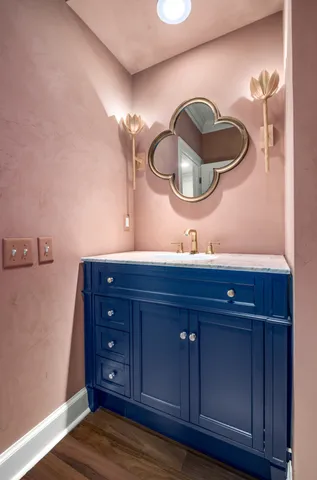 a bathroom with a sink and a mirror