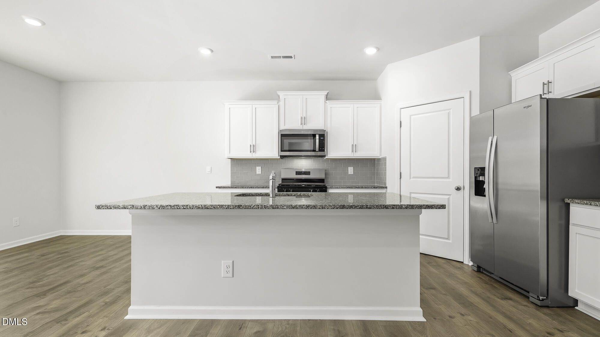 1376 Lansdowne Drive Mebane, NC 27302 - Photo 6 of 22 a kitchen with stainless steel appliances cabinets a sink and a refrigerator