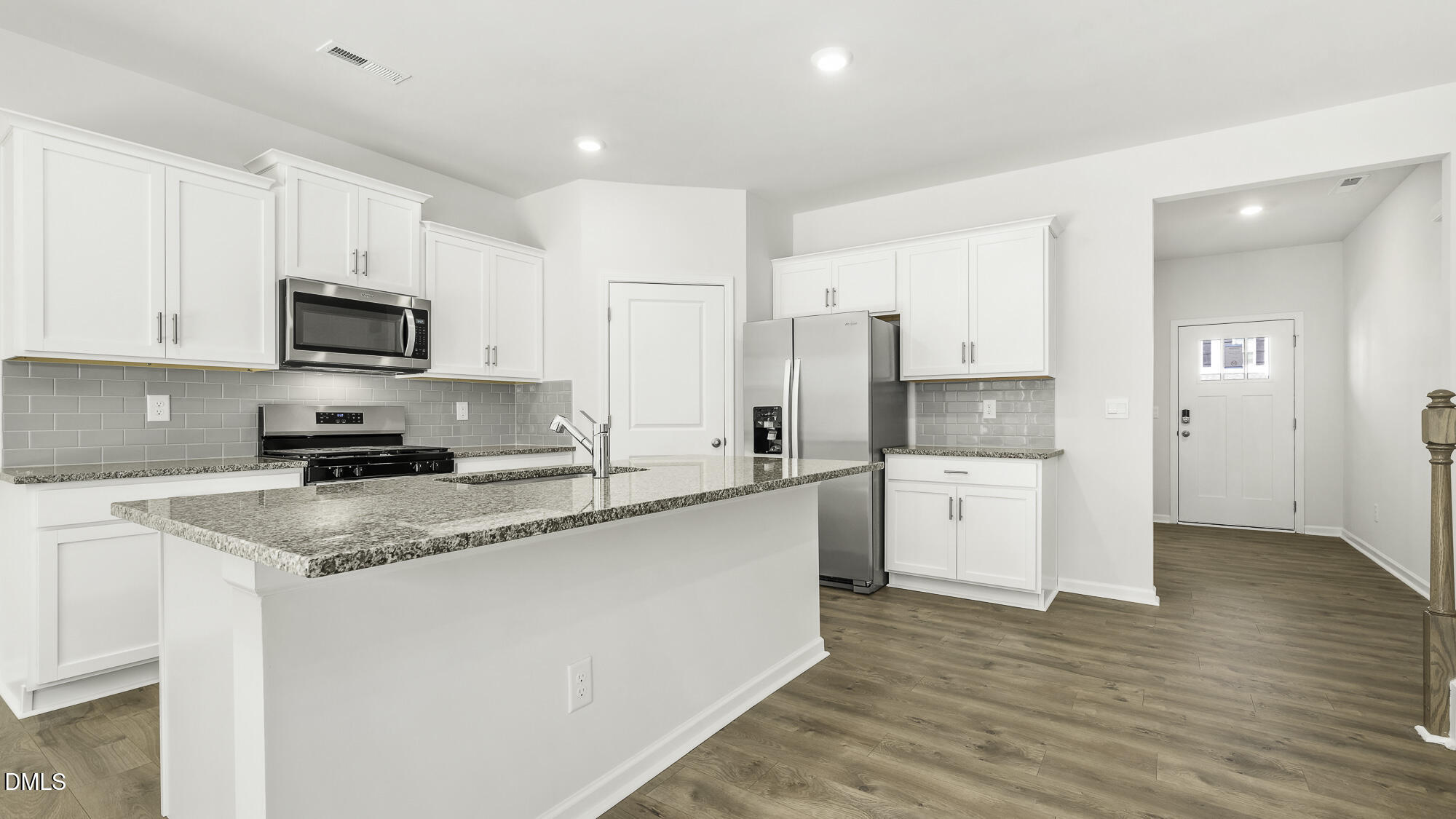 1376 Lansdowne Drive Mebane, NC 27302 - Photo 8 of 22 a kitchen with a refrigerator and a stove top oven