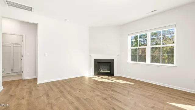 a kitchen with a refrigerator and a stove top oven