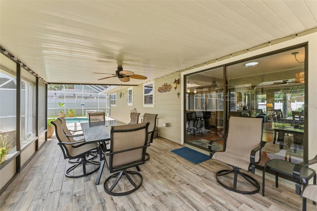 6355 Sebring Street Weeki Wachee, FL 34607 - Photo 45 of 65 a dining room with furniture and wooden floor