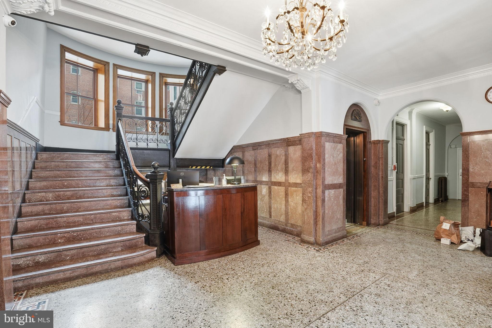 2220 20th Street Northwest, Unit 33 Washington, DC 20009 - Photo 26 of 30 Elegant foyer with grand staircase charm.