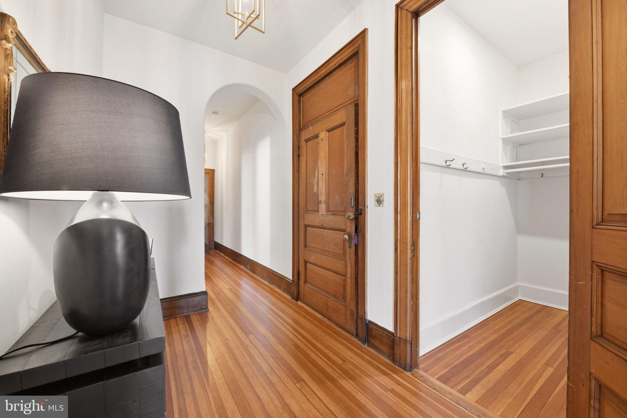 2220 20th Street Northwest, Unit 33 Washington, DC 20009 - Photo 4 of 30 Elegant hallway with rich wood tones.