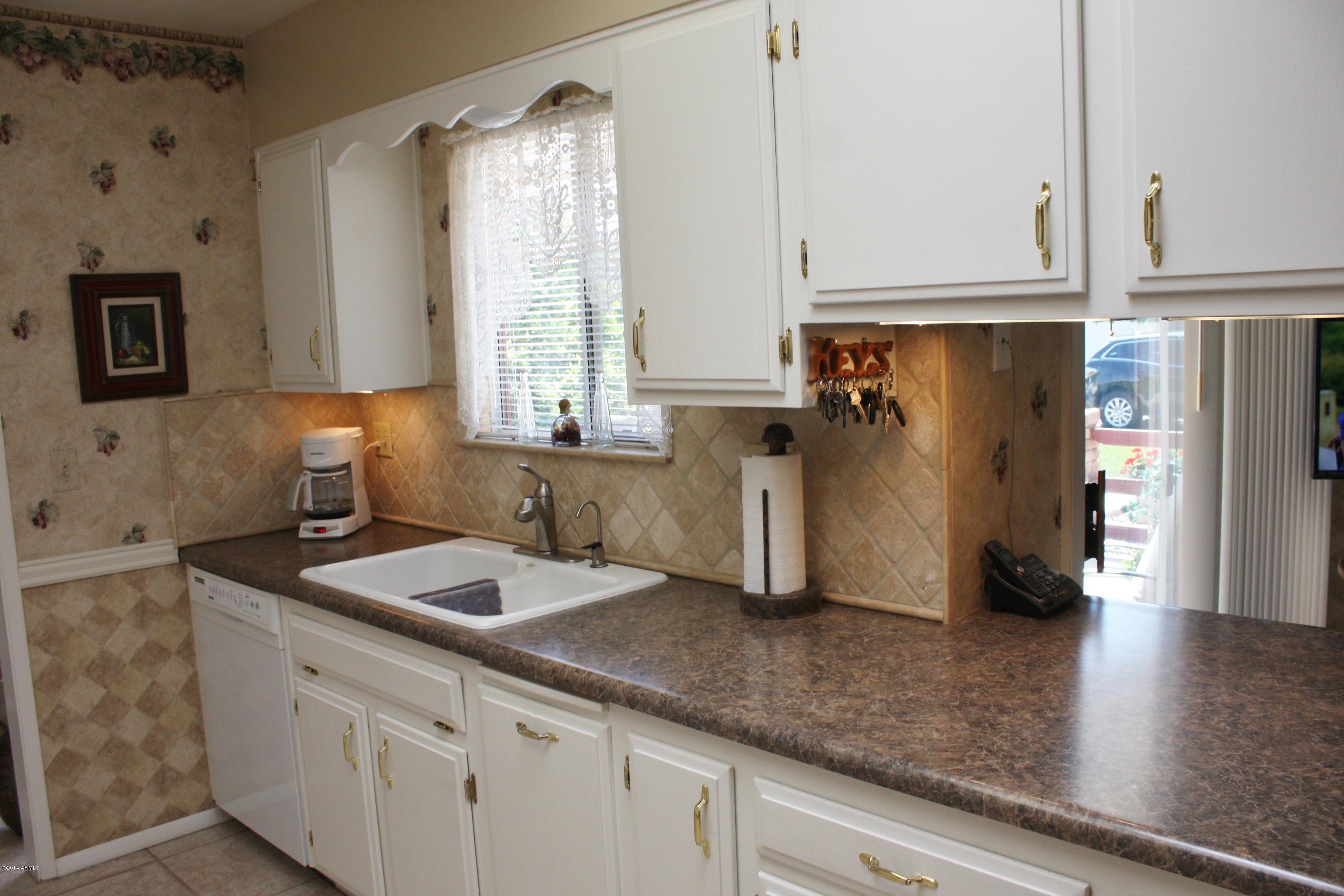 10726 West Hatcher Road Sun City, AZ 85351 - Photo 15 of 32 Beautiful Tiled Backsplash