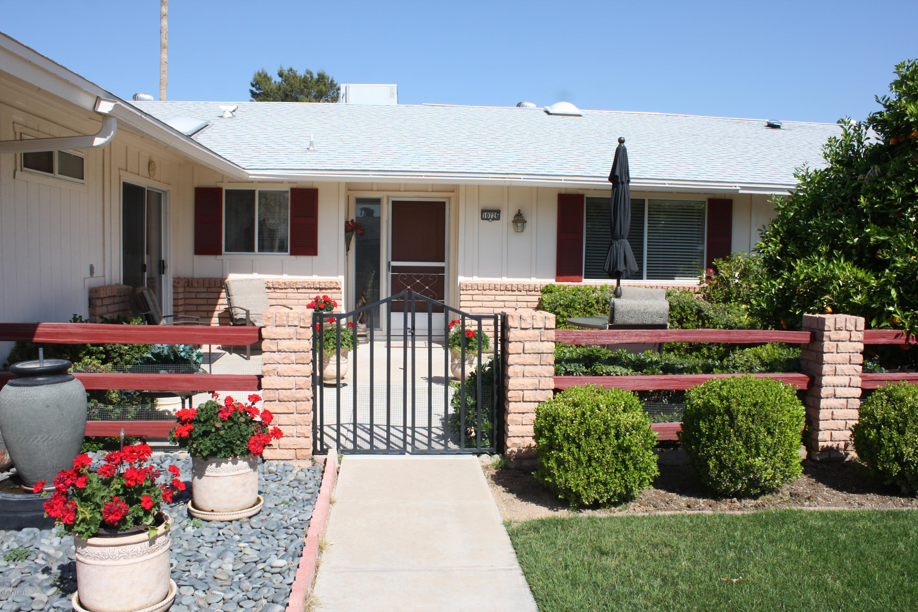 10726 West Hatcher Road Sun City, AZ 85351 - Photo 2 of 32 South Facing Front Patio