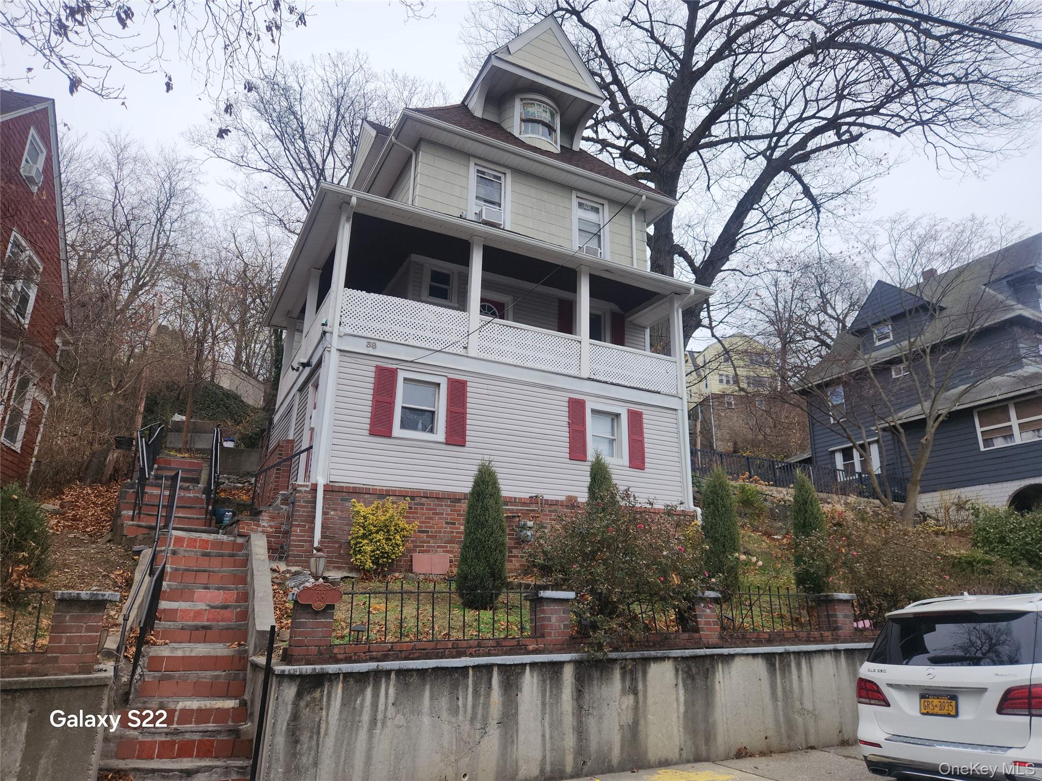38 Cornell Avenue Yonkers, NY 10705 - Photo 1 of 11 a front view of a house with trees