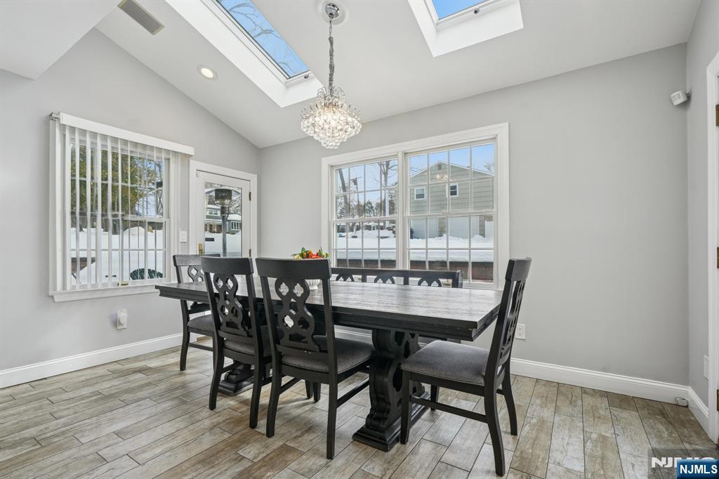 25 Nathan Way Wayne, NJ 07470 - Photo 13 of 36 a view of a dining room with furniture window and wooden floor