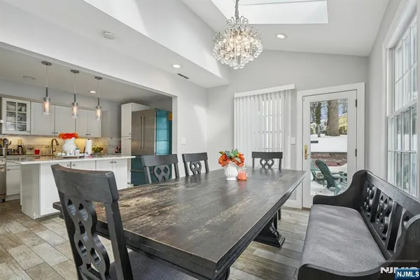 a kitchen with stainless steel appliances granite countertop a stove and a sink