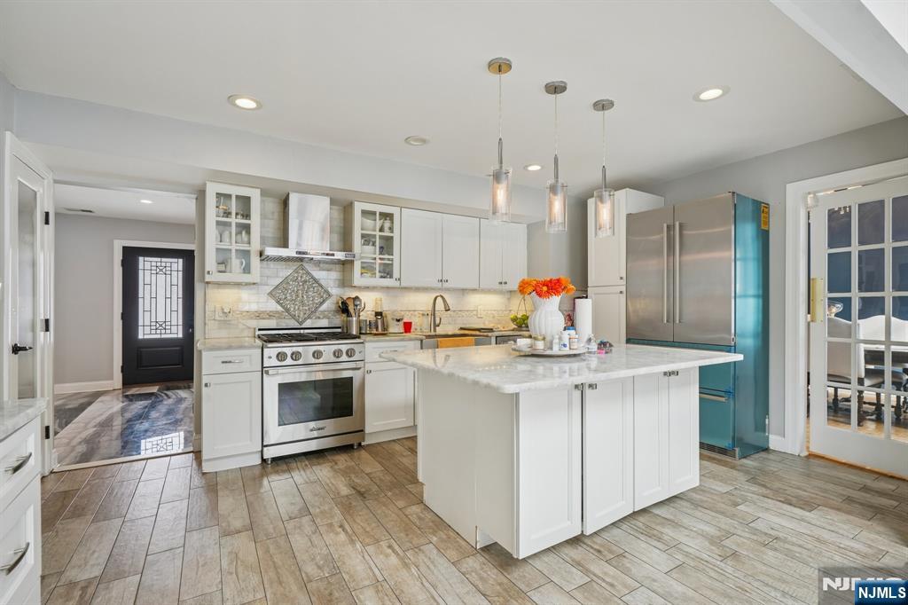 25 Nathan Way Wayne, NJ 07470 - Photo 18 of 36 a kitchen with stainless steel appliances granite countertop a stove and a sink