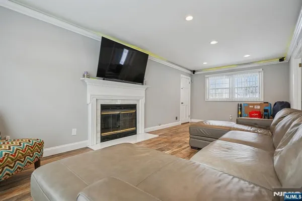a bedroom with bed and wooden floor