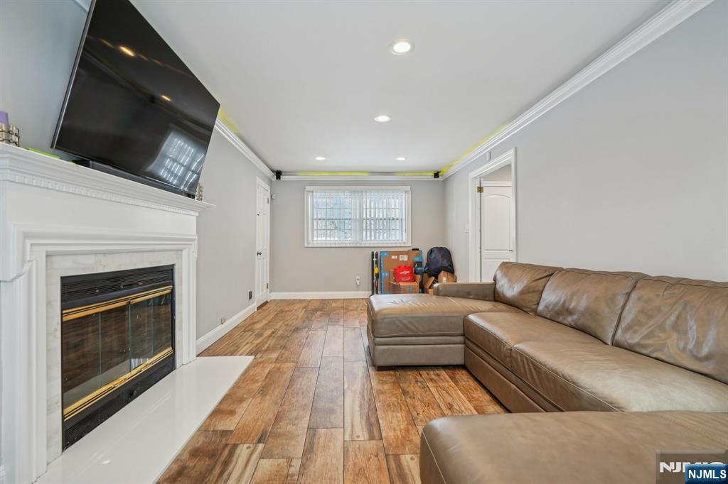 25 Nathan Way Wayne, NJ 07470 - Photo 20 of 36 a living room with furniture and a fireplace