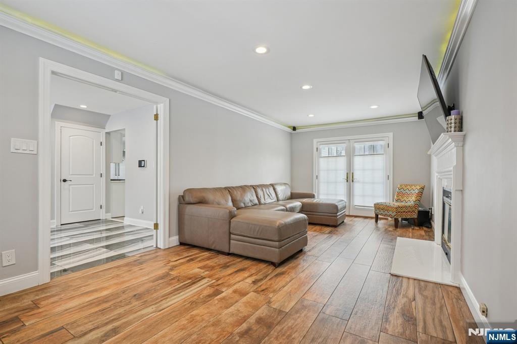 25 Nathan Way Wayne, NJ 07470 - Photo 21 of 36 a living room with furniture and a wooden floor