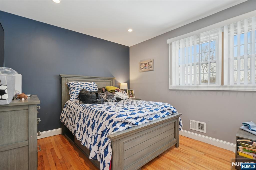 25 Nathan Way Wayne, NJ 07470 - Photo 24 of 36 a bedroom with a bed and a window