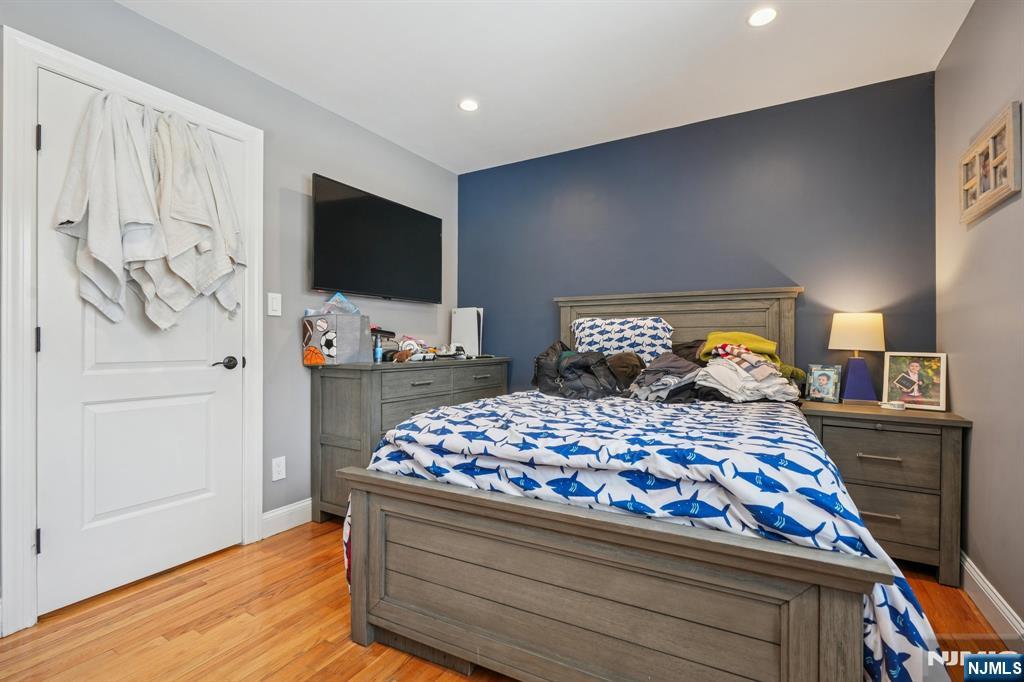 25 Nathan Way Wayne, NJ 07470 - Photo 25 of 36 a bedroom with bed and wooden floor