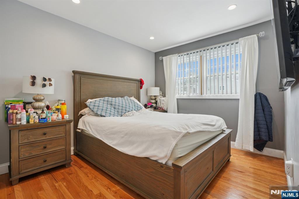 25 Nathan Way Wayne, NJ 07470 - Photo 27 of 36 a bedroom with a bed and a window