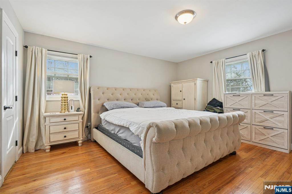 25 Nathan Way Wayne, NJ 07470 - Photo 30 of 36 a bedroom with a bed and a dresser