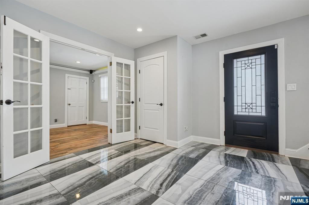 25 Nathan Way Wayne, NJ 07470 - Photo 3 of 36 a bedroom with a bed and a window