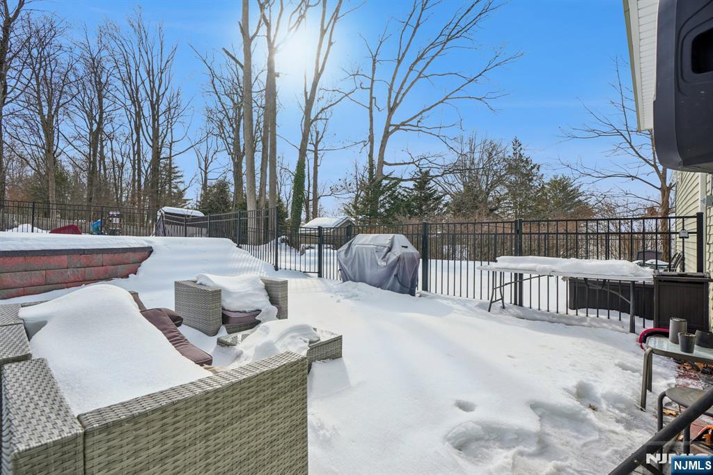 25 Nathan Way Wayne, NJ 07470 - Photo 33 of 36 a view of roof deck with couches and wooden fence