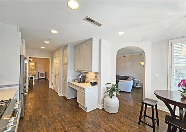 a store room with stainless steel appliances and a table
