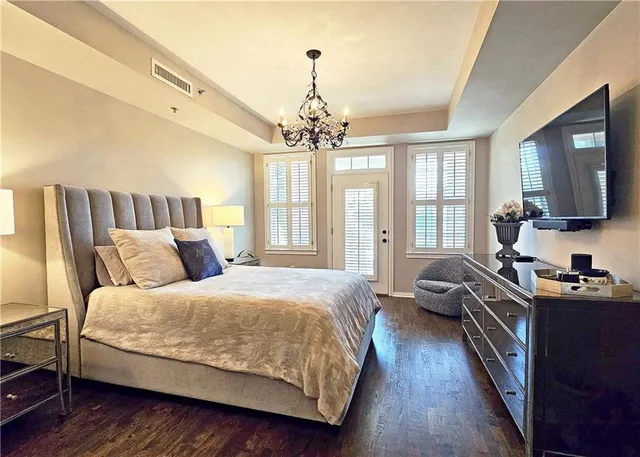 a view of walk in closet with clothes