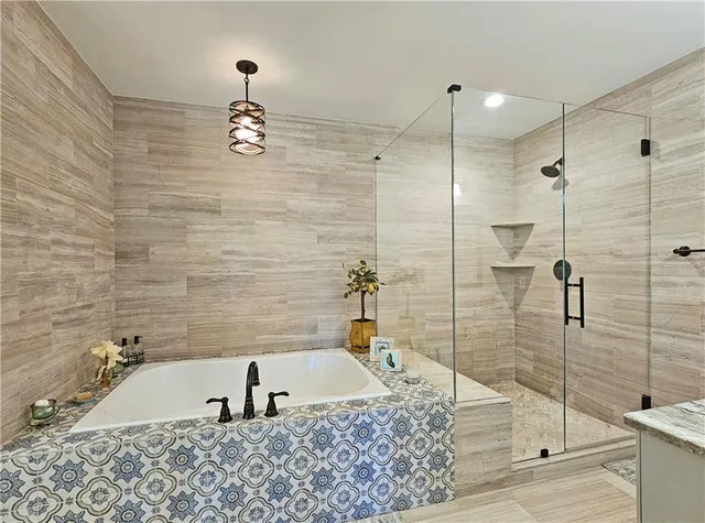 a bathroom with a tub and sink