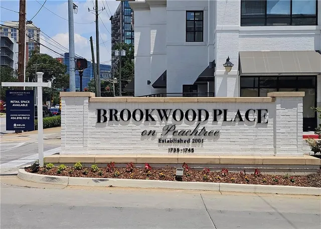 a view of a street with sitting area