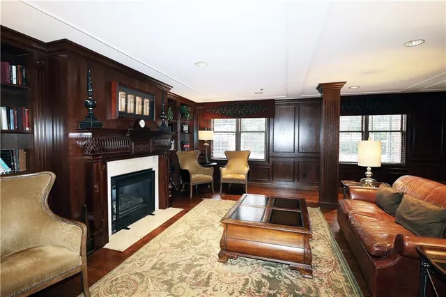 a dining room with furniture and wooden floor