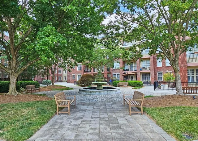 a view of a chairs and table in backyard