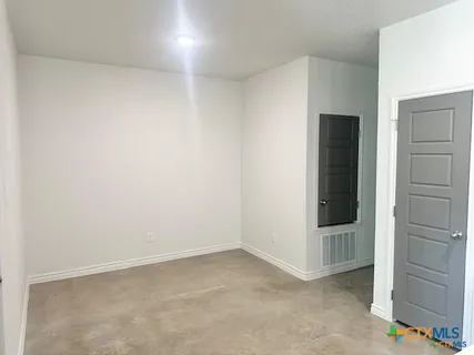 an empty room with a hallway