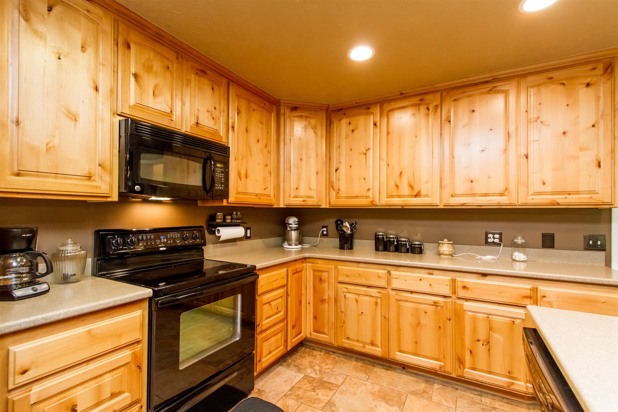 8404 Cedar Grove Road Cross Plains, TN 37049 - Photo 14 of 30 a kitchen with stainless steel appliances granite countertop a stove a sink and a microwave