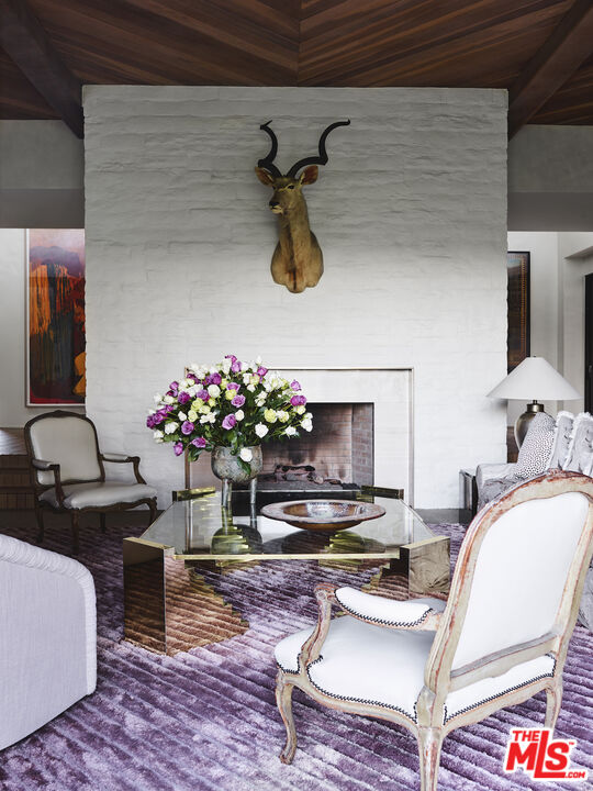 40471 Sand Dune Road Rancho Mirage, CA 92270 - Photo 11 of 42 a living room with furniture and flowers
