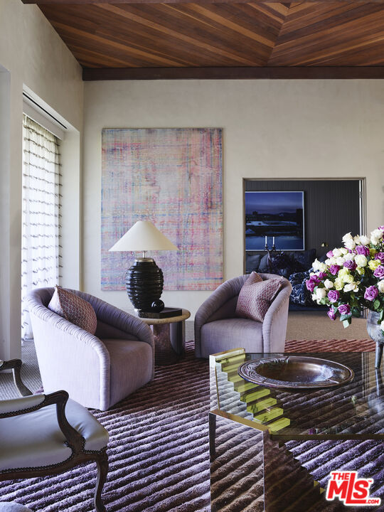 40471 Sand Dune Road Rancho Mirage, CA 92270 - Photo 13 of 42 a living room with furniture and flowers