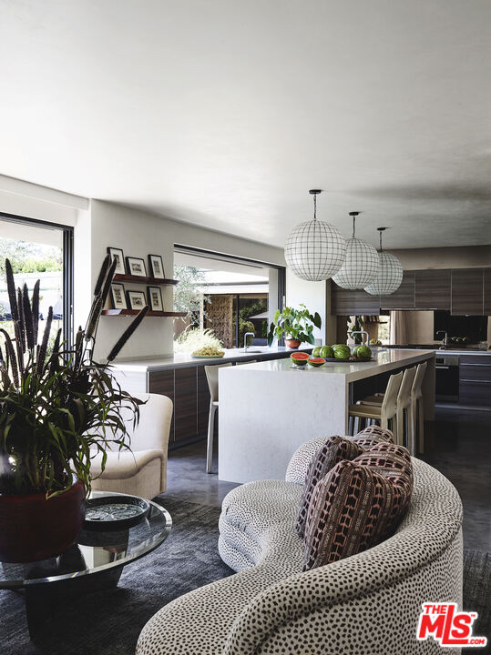 40471 Sand Dune Road Rancho Mirage, CA 92270 - Photo 15 of 42 a living room with furniture and a chandelier