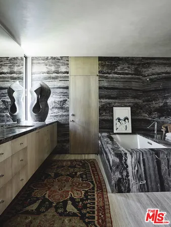 a view of a closet with wooden floor