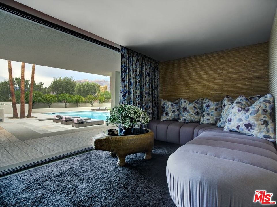 40471 Sand Dune Road Rancho Mirage, CA 92270 - Photo 20 of 42 a living room with furniture and a large window
