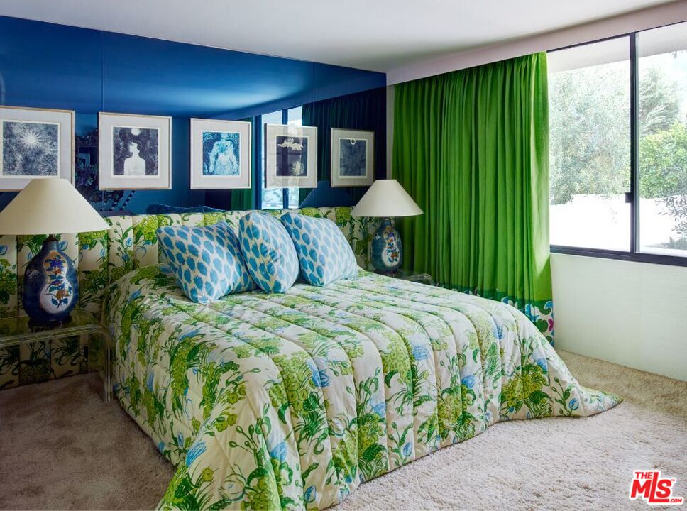 40471 Sand Dune Road Rancho Mirage, CA 92270 - Photo 25 of 42 a spacious bedroom with a bed and a window