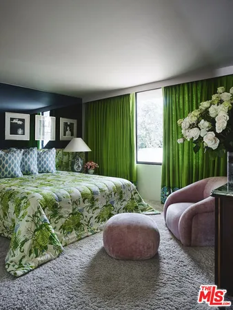 a living room with furniture and a lamp