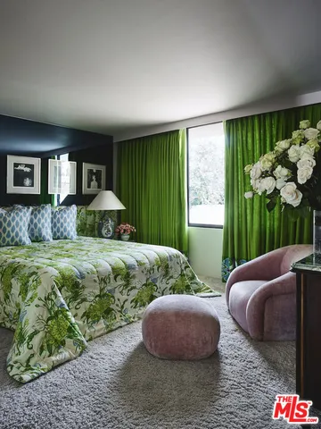 a living room with furniture and a lamp