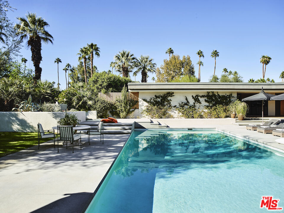 40471 Sand Dune Road Rancho Mirage, CA 92270 - Photo 32 of 42 a view of a swimming pool with a yard and plants