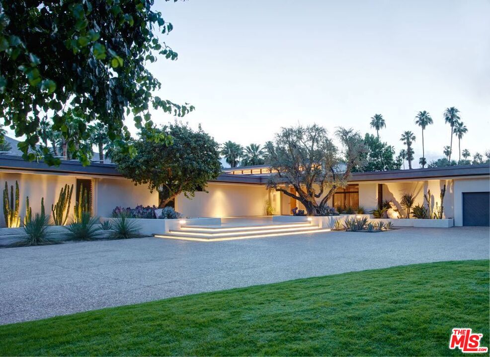 40471 Sand Dune Road Rancho Mirage, CA 92270 - Photo 38 of 42 a view of backyard with swimming pool and seating space