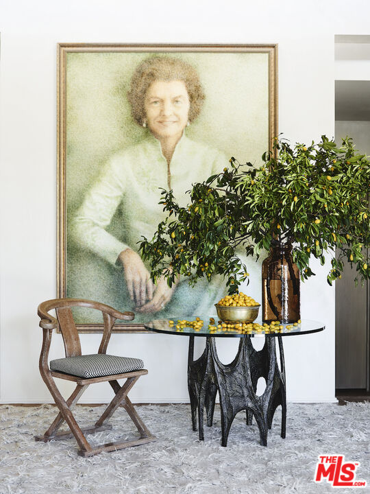 40471 Sand Dune Road Rancho Mirage, CA 92270 - Photo 7 of 42 a table with chairs and a vase of pink flowers