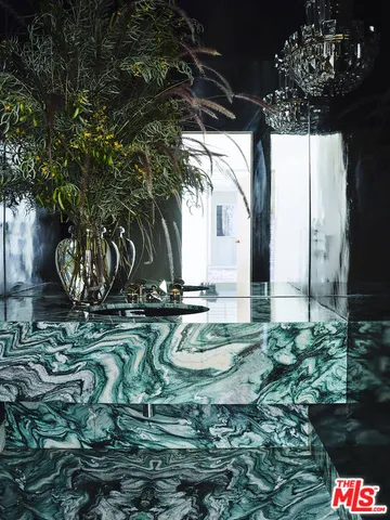 a lobby with furniture and floor to ceiling window