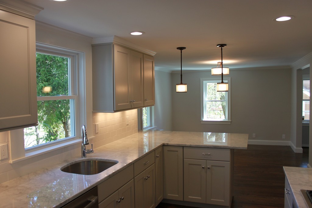 52 Roundwood Road Newton, MA 02464 - Photo 6 of 19 a kitchen with granite countertop a sink and a counter top space