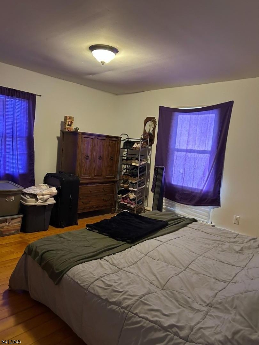 73 Featherbed Lane Flemington, NJ 08822 - Photo 11 of 22 a bedroom with a bed and wooden floor