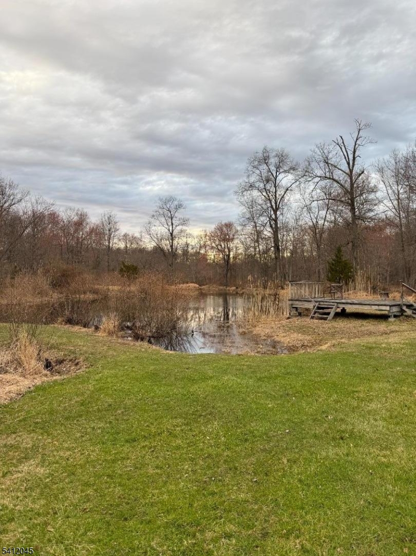 73 Featherbed Lane Flemington, NJ 08822 - Photo 7 of 22 a view of a lake with houses