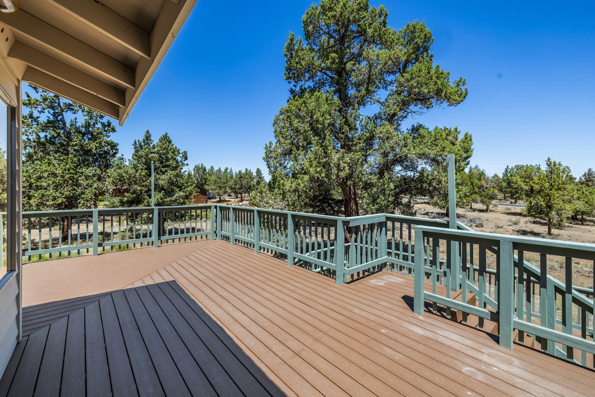 64586 McGrath Road Bend, OR 97701 - Photo 26 of 27 a view of balcony with wooden floor and fence