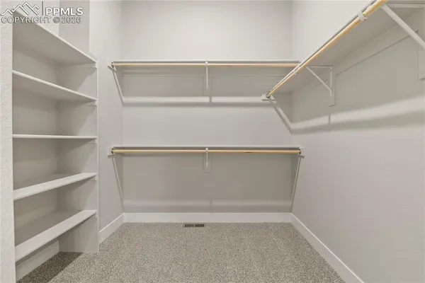 a view of an empty walk in closet