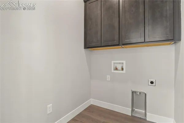 a view of door with wooden floor