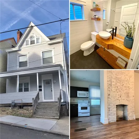 a view of a brick house with many windows